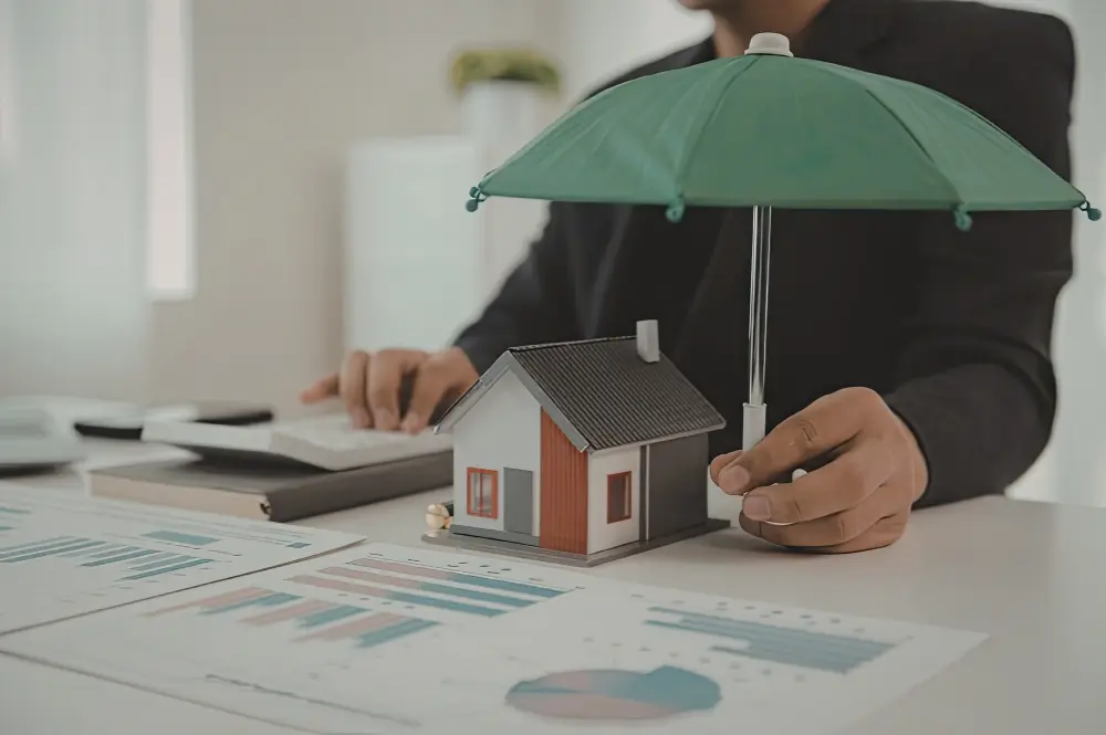 A homeowner reviewing umbrella insurance options with a financial advisor in a cozy office setting.